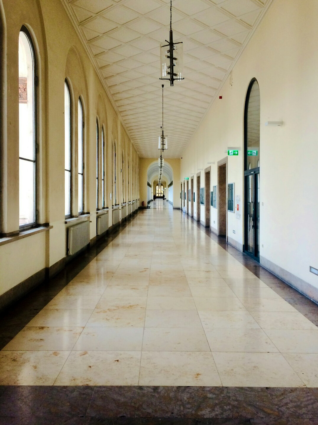 Elegant modern university hallway with large windows and natural light